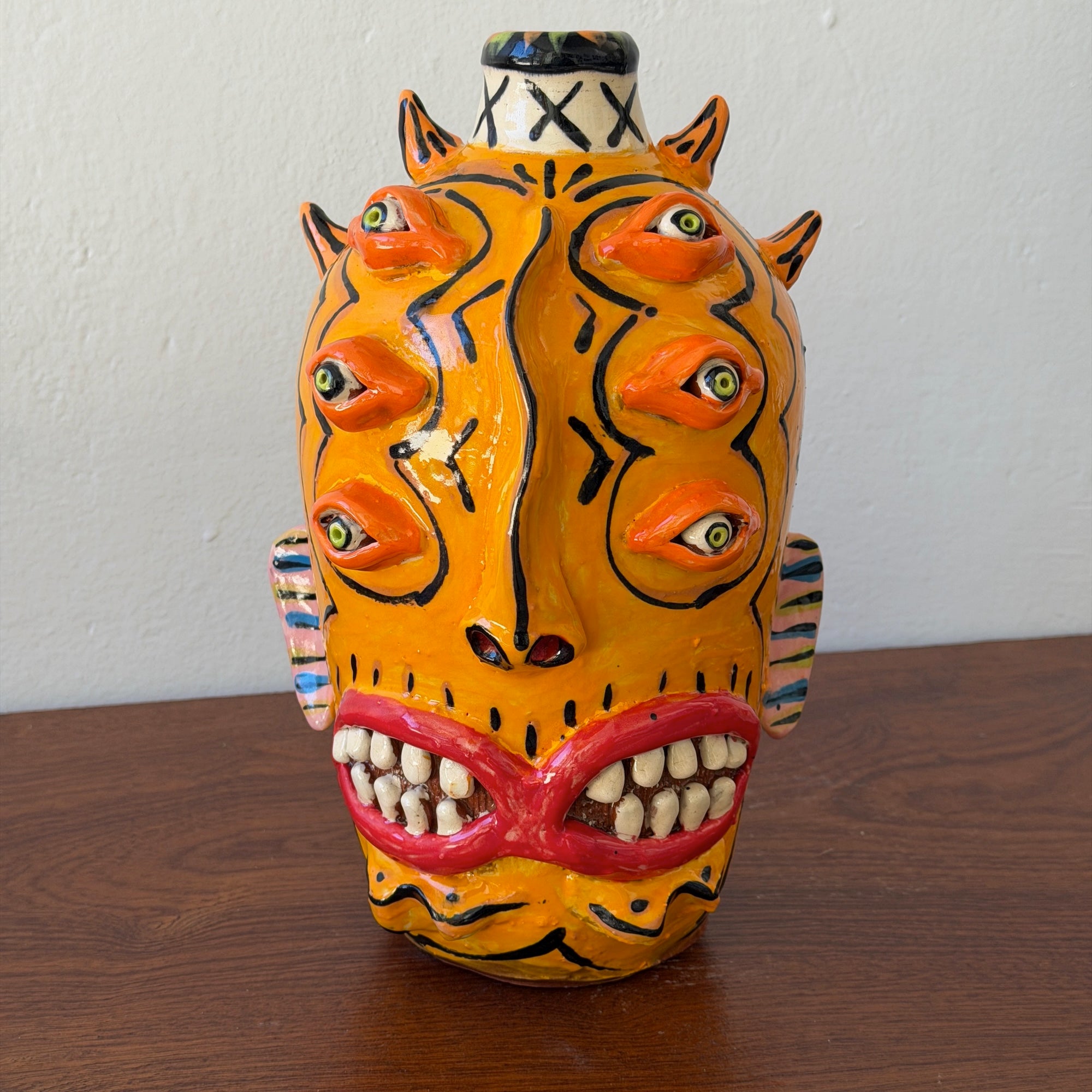 Orange 6 Eyes 2 Mouths