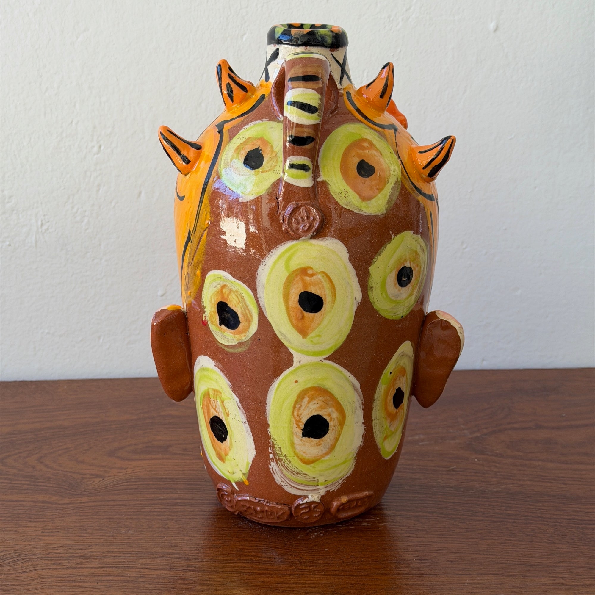 Orange 6 Eyes 2 Mouths