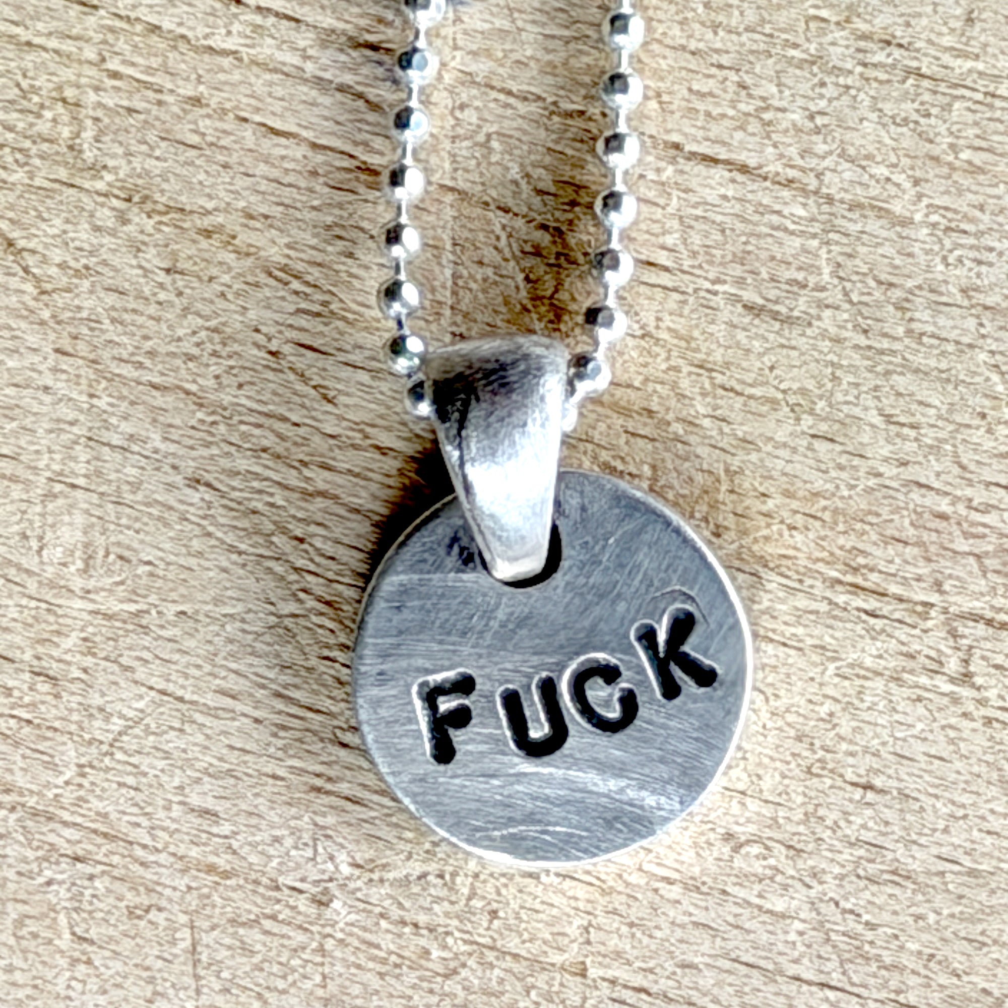 Silver Brass Skull Joder Hielo Necklace, by Margaret Sullivan at